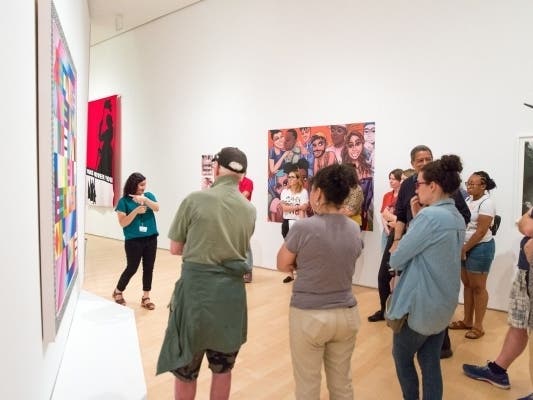 A teaching artist leads an ASL tour, 2019. 