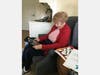 A King-Bruwaert resident enjoys a Face-Time session to stay connected with family.
