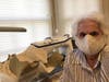 Pat Jahn models one of the masks she created.