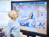 New iN2L technology encourages King-Bruwaert House residents to interact with 4,000 topics and images.