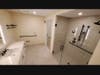 Spacious bathrooms include no-lip shower entries and generous storage space.