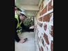 Jeff Diqui of the International Masonry Institute (IMI) reviews original schmearing on the King-Bruwaert House building.