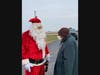 Santa visits with a woman supported by Trinity Services Dec. 18 at a home in Manhattan, Illinois.