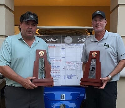 LRHS girls golf coach Mick Koczersut (l) and boys coach Dave Frantz show off their trophies