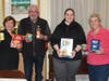 Laurie, Jim, Adriana and Paula hold a few of the items collected for the food pantry