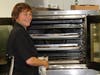 Laurie bakes multiple Talia Di Napoli pizzas for members