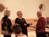 Sandra accepts a certificate of induction from President Paula
