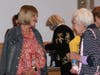 Members catch up after the ceremony