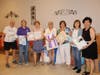 Members display several items from the white good drive for Mission of Deeds.