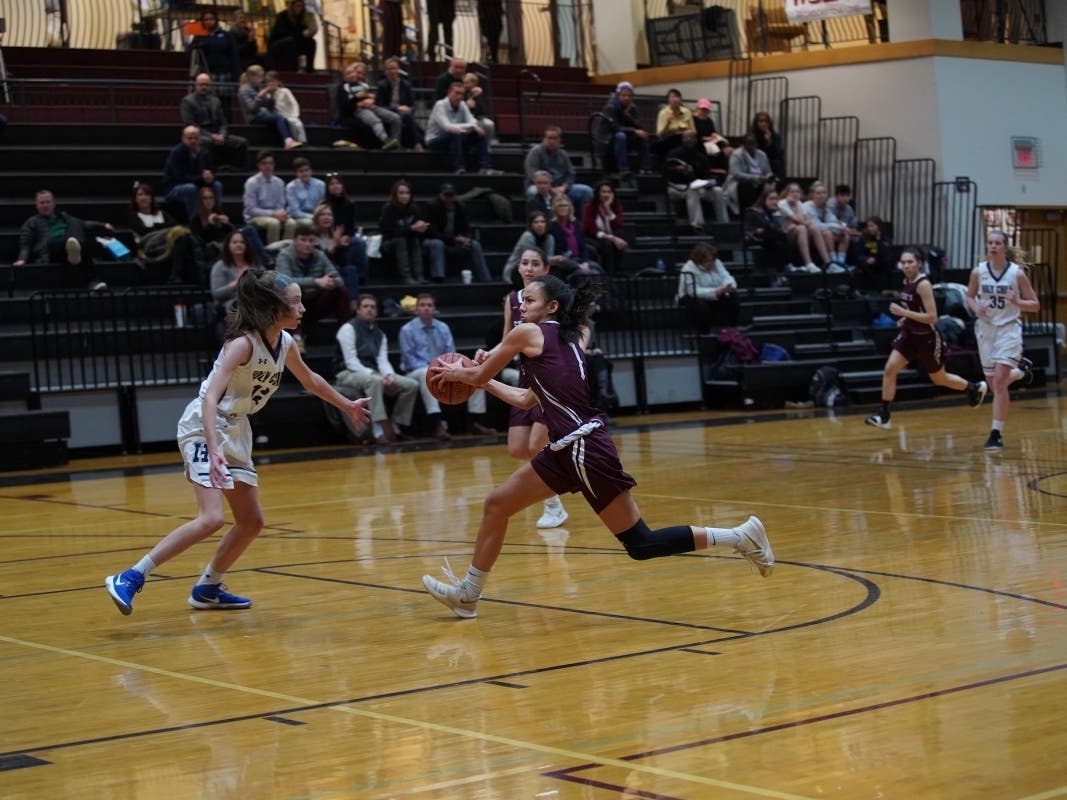Caroline Lau of Westport playing for the St. Luke's Girls Varsity Basketball team