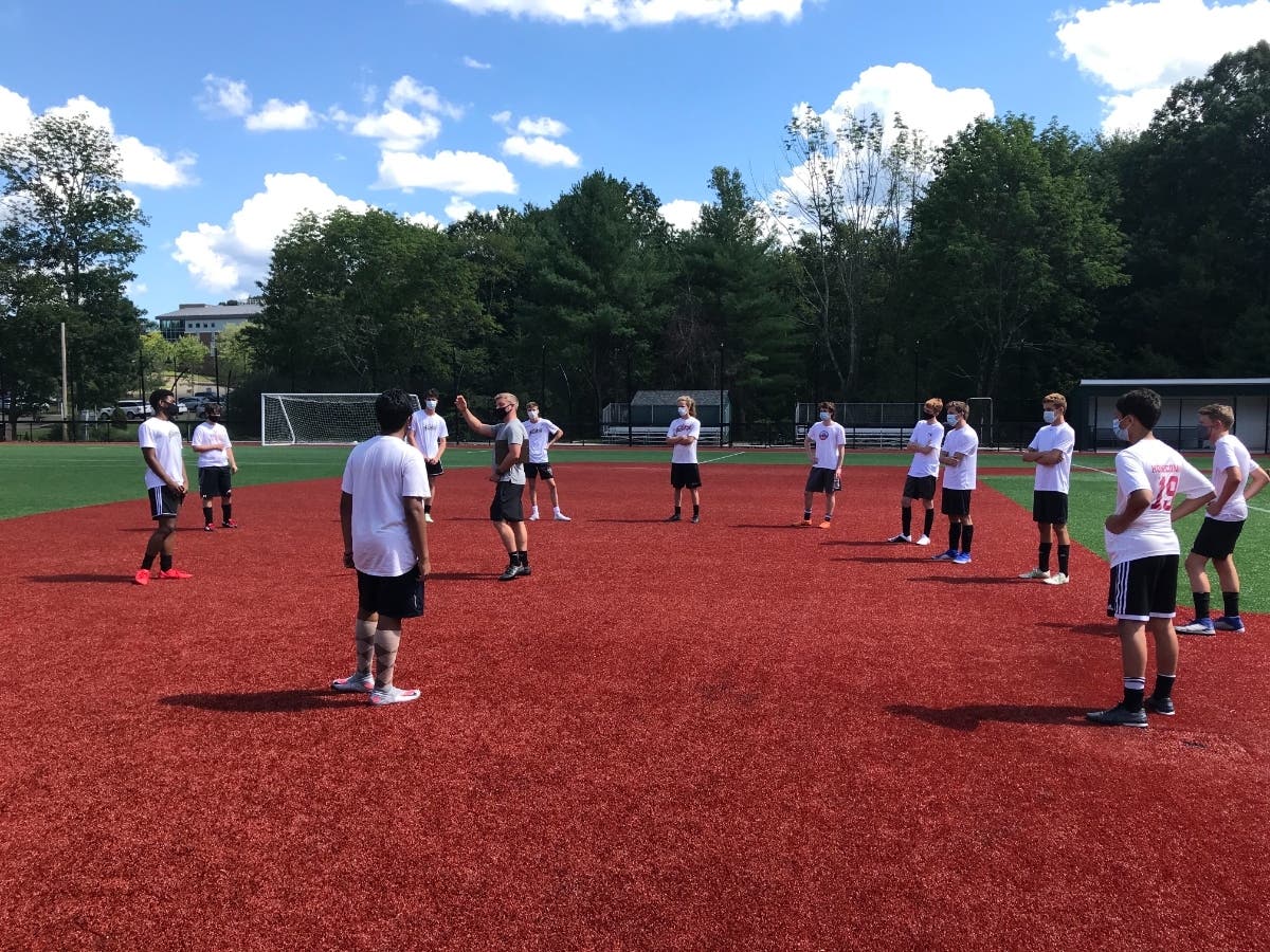 St. Luke's Boys Soccer Coach Ryan Fairhurst giving instructions to his players