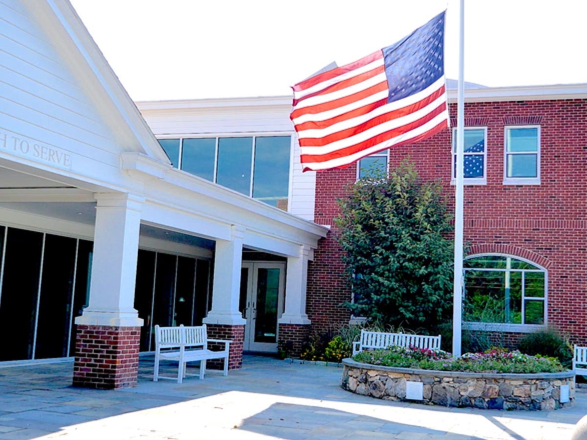 The flag outside of St. Luke's School in New Canaan.