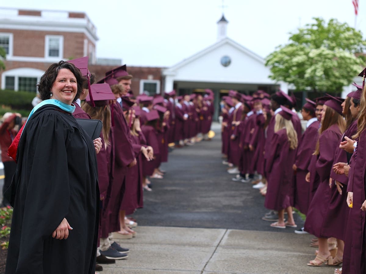 St. Luke's Head of Upper School Liz Perry stands with the Class of 2022 before the 93rd Commencement on June 3, 2022. 