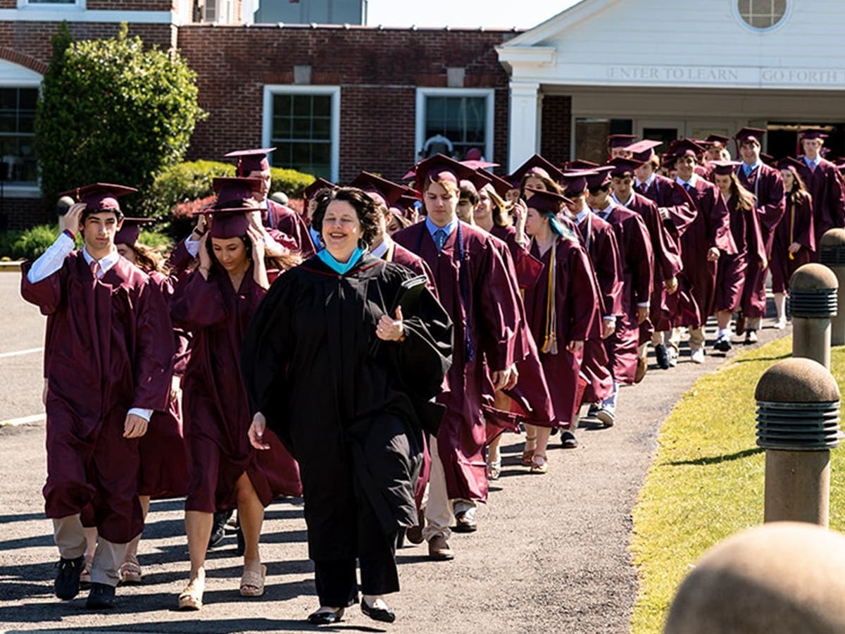 Head of Upper School Liz Perry leads the Class of 2023 into the Commencement Ceremony. 