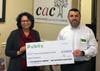Tamara Carrera, left, CEO of the CAC and Bruce Humphries, Publix District Manager for the Atlanta Central West Region.