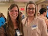 Melisa Mantha, RN, nurse case manager (left), spoke to guests about the rewards of her work as a visiting nurse. She's pictured with Catherine Frasco, DPT, vice president of home health operations.