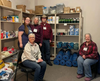 Compassion for Campers volunteers with stock for a distribution at a Community Resource Day at Willow Church Crystal Lake.
