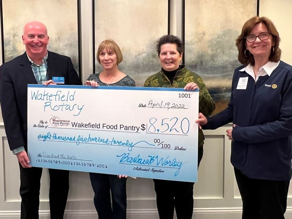 (left to right) Club President Bruce Donovan, Food Pantry Board President DOreen McGowan, Club Secretary Suzanne Bowering and Club Treasurer Barbara Worley
