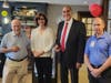 Paul Harris Fellowship Awards were presented to Norm Theriault (left), John Tramontozzi (center right), and Jim Fitzgerald (right) by Barbara Worley.