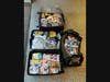 Three suitcases were packed for delivery. 