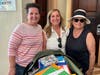 Rotarians Suzanne Bowering, Janice Casoli and Lisa Roderick delivered 140 pounds of supplies to the Sandy Point Primary School.
