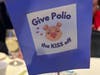 Attendees were invited to "fill the purple piggies" to donate to eradication efforts, raising several thousand more dollars for the campaign to eradicate polio.