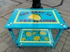 Local artist Claudia Rodriguez created this zesty cart for Little Peoples Country Academy or Arts & Education.