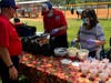 Picnics at the start and end of each season are fun events away from the diamond. In this photo Dave and Donna Glauner serve up a positive end to a season filled with uncertainity of playing softball within Covid 19 requirements. 