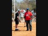 Umpire Ron Quatkemeyer briefs Mayor Ken Welch on details of the annual game
