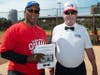 Mayor Ken Welch holds a copy of "90 Years And Still Playing" and is welcomed by Ed Broomes, President of the Kids and Kubs. "90 Years..."archives commemoration and history of the Three-Quarter Century Club aka Kids and Kubs.