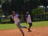 Transplant Team shortstop fields and throws to first base during the annual benefit game in 2018. 