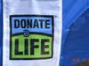 The "Donate Life" banner displayed during the annual game held at North Shore Park, in St Petersburg. Members of the hospital encouraged organ donation by those in attendance. 