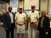St Petersburg Mayor Ken Welch and City Council Chair Gina Discoll receive the traveling trophy won by Welch's City Hall Stars February 15.2022. Holding Trophy is Kids and Kubs President Will Michaels accompanied by Kids&Kubs Board Member Jerry Wollman.