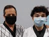 Masks were only removed momentarily for a photo the day that Mr. Osterloh came into the Academy to receive his First Dan Black Belt from master Waldron.
