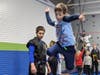 Academy student launching off a trampoline