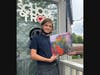 Sam Selikoff, a student at School of Rock Montclair, holds the new album by Guided by Voices called "Mirrored Aztec".