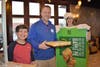 Student Jack Rubly and Teacher Mr. Christiansen pose with McPie Principal Balaskovits 