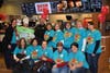 The St. Thomas More Staff poses with Elgin Police Sergeant Ricky Demierre during McTeacher's Night