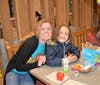 Student Sophie Mendonca was happy to see her teacher Mrs. Schneider at McTeacher's Night