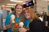 Katelyn Williams and Ashley Porras work hard on ice cream to serve Grande Park students.