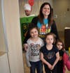 Students Lila, Ella, And Nova Retterer were happy to see teacher Nicole Dyche at McTeacher's Night