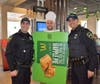 Jake Countryman dressed as an apple pie, pose with Sugar Police Officers Batitsas, and Alcaraz during McTeacher's Night