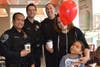 Joshua and Gabriella Washington were thrilled to get a picture with Officers Wood and Arevalo.