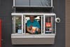 Teacher Mark White manned the drive-thru window, delivering orders and collecting donations   