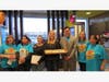 Field Elementary staff and PTO members join Principal Luis Bonilla in greeting the students and families of Field school