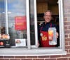 Teacher Jay Prichard works the drive-thru