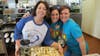 Whitman Elementary School Teachers Karin Wilson, Claudine Mele and Megan McCann are ready to serve delicious apple pies 