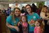 Brittany Muszynski and Kate Gilhooly greet students Giuliana Alvarado and Tiffany Herrea 