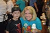 ​Fun-loving principal Laurie Kovalcik proudly shows her perfectly made ice cream cone to Mattie Cooper! 