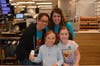 Abbie Folan and Audrey Frystak have a blast at McTeacher's Night with teachers Depa and Pavlowski.
